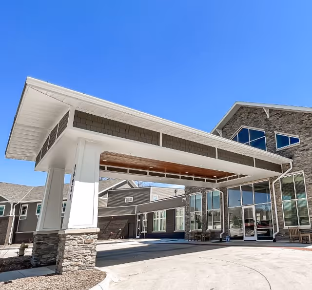 Exterior view of Edencrest at Timberline entrance with a covered porte-cochere.
