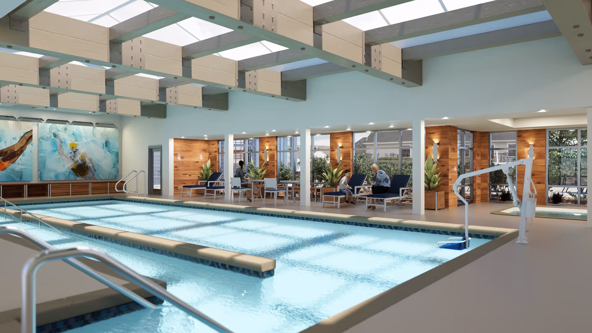Indoor swimming pool area with clear blue water, metal handrails, and a pool lift. The ceiling has large skylights allowing natural light to fill the space. Along the far side of the pool, there are lounge chairs and tables with people sitting and conversing. The walls feature large windows and wooden paneling with plants placed around the seating area.