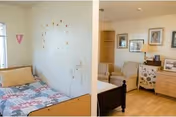 A cozy senior living facility room at Rosewood Court featuring a single bed with a colorful quilt, a small seating area with two armchairs, a wooden dresser with framed pictures and decorative items, and light-colored walls adorned with small wall decorations and framed artwork.