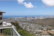 Balcony view from Maunalani Nursing and Rehab Center overlooking city, hills, and ocean.