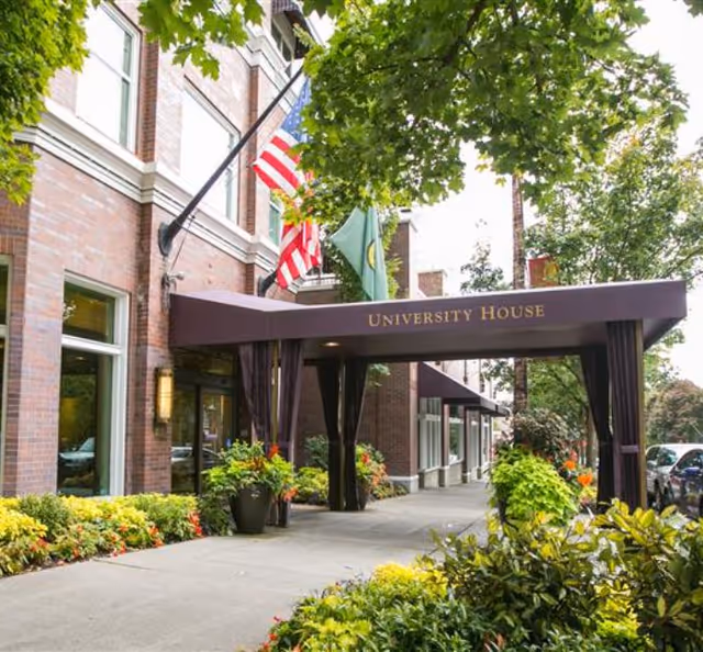 University House Wallingford entrance canopy with flags and greenery.