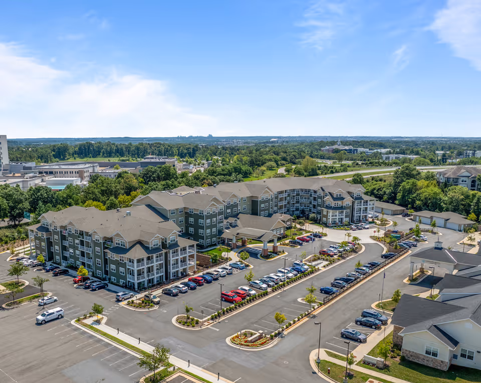 Aerial view of Hessler Heights Gracious Retirement Living campus with multiple buildings and parking