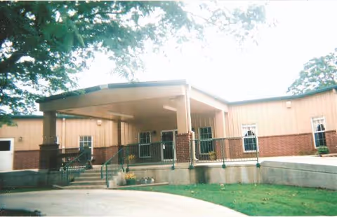 Exterior view of Copp's Residential Care front entrance with ramp and stairs