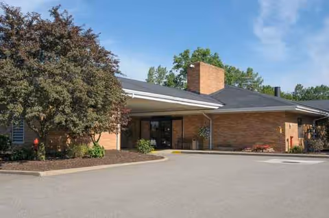 Life Care Center of Medina exterior with brick entrance and parking lot.