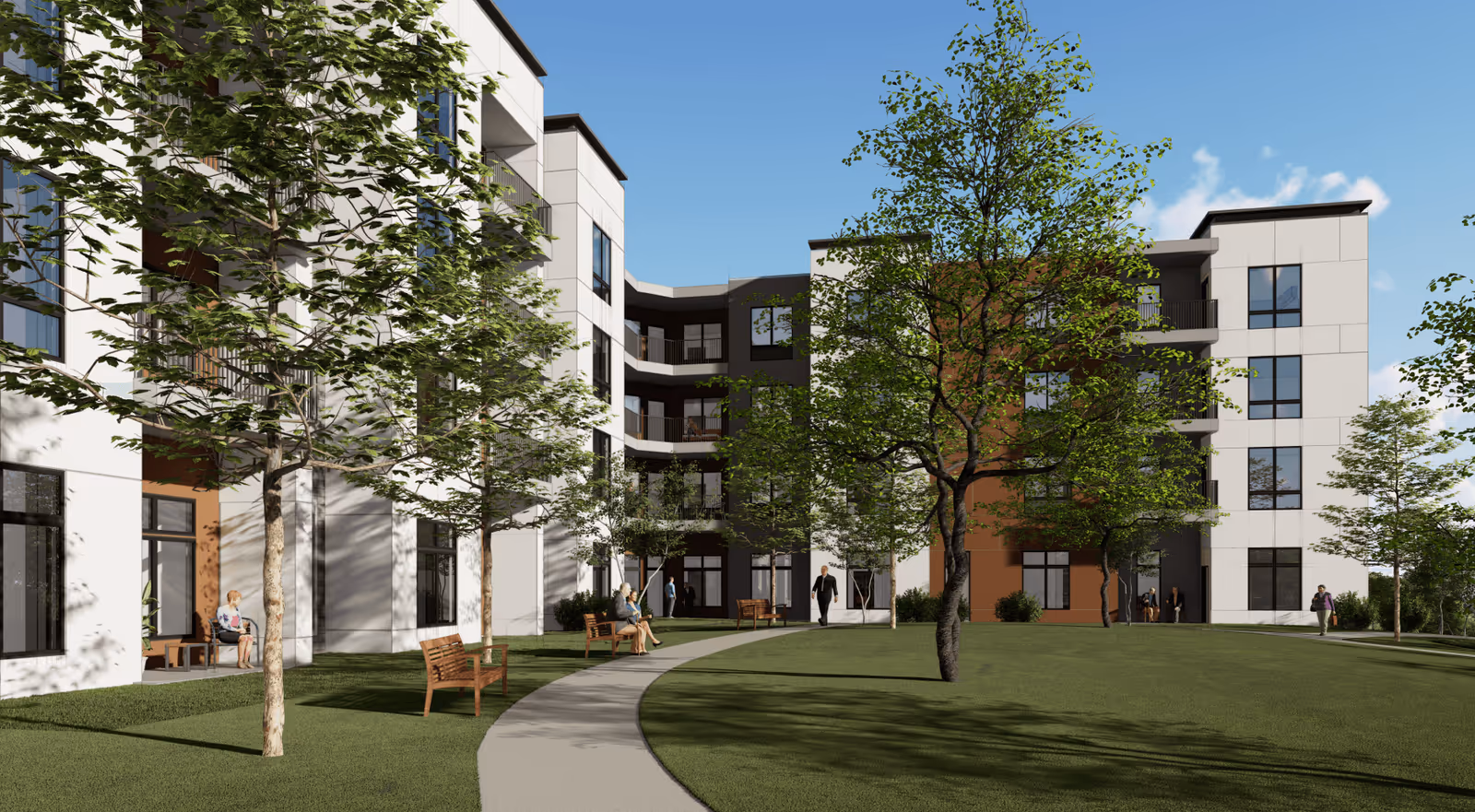 Outdoor courtyard area of a senior living facility with a curved walking path, green grass, several trees, wooden benches, and a modern multi-story building in the background. People are sitting on benches and walking along the path under a clear blue sky.