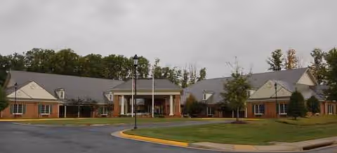 Exterior view of Brookdale Midlothian: single-story brick senior living facility with a curved driveway.