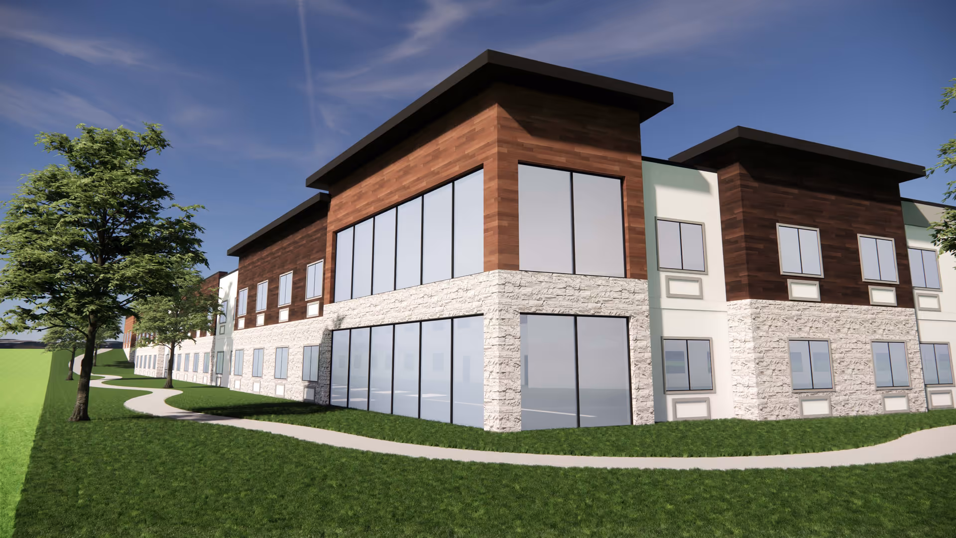 Exterior view of a modern two-story senior living facility building with large windows, stone and wood paneling, surrounded by green grass and trees under a blue sky.