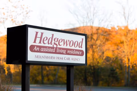 Exterior view of Hedgewood sign for an assisted living residence.