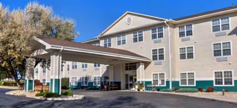 Exterior of Brookdale El Camino senior living facility with covered entrance and teal base trim