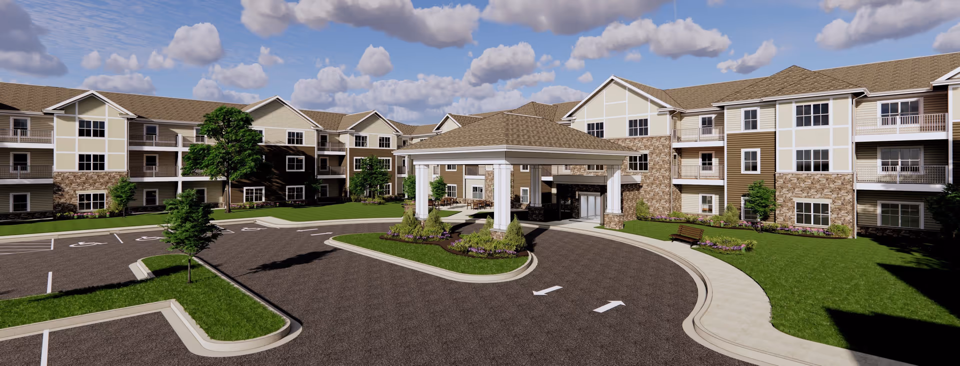 Three-story apartment-style senior living building with a covered entrance/porte-cochère, circular driveway, landscaped islands, and a partly cloudy sky.