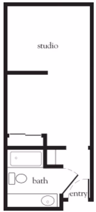 Floor plan of a studio apartment showing an entry area, a bathroom with a bathtub, toilet, and sink, and a main studio living space.