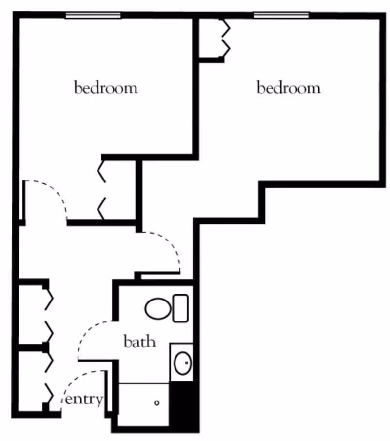 Floor plan layout showing two bedrooms, a bathroom, and an entry area with closets.