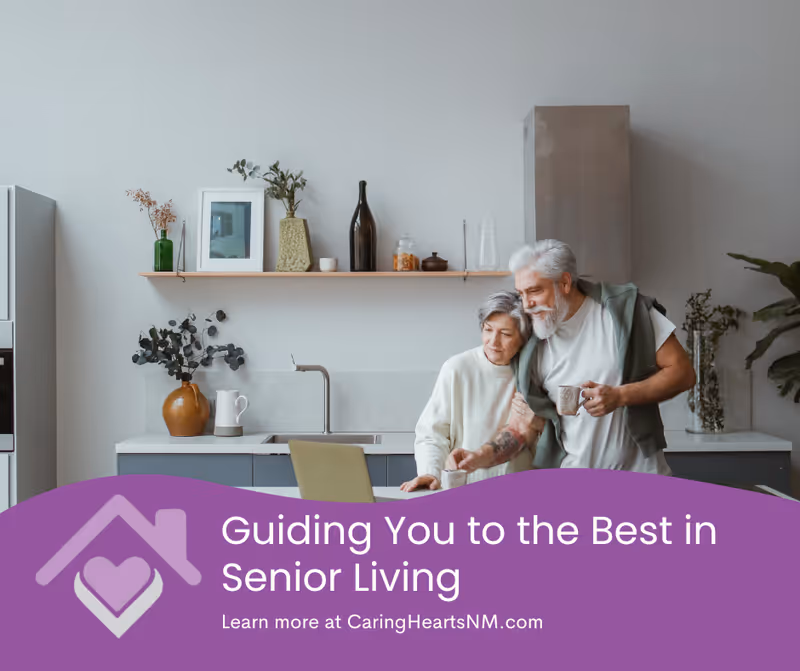 An elderly couple standing close together in a modern kitchen. The woman is leaning on the counter while the man holds a cup and wraps his arm around her shoulders. The kitchen has a minimalist design with a shelf holding decorative items and plants above the sink.