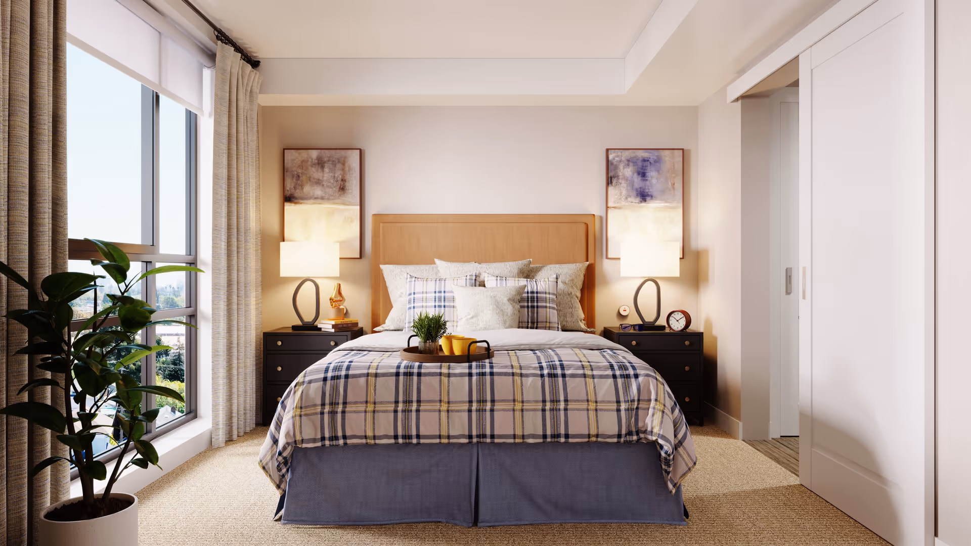 Bright, well-appointed bedroom with a bed dressed in plaid bedding, two bedside tables with lamps, a large window and a potted plant.