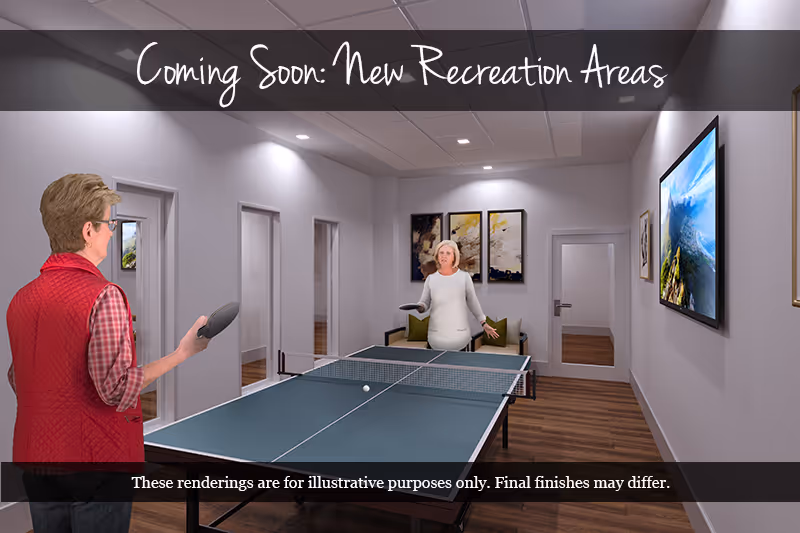 Two elderly women playing table tennis in a well-lit indoor recreation room with modern decor, including framed artwork on the walls and a large TV screen. The room has wooden flooring and several doors leading to other areas.