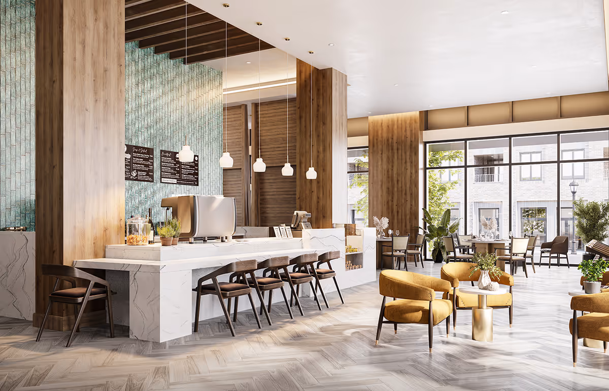 Bright modern lounge and café area with a marble service counter, bar stools, and seating groups near large windows.