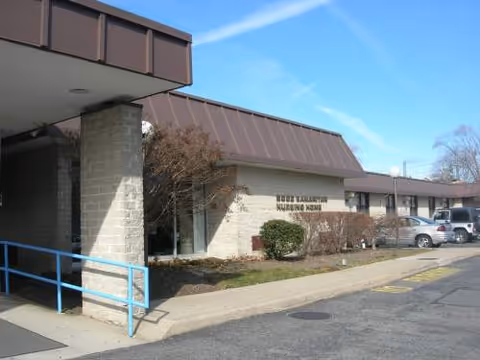 Exterior view of Good Samaritan Nursing Home with parking and blue railing