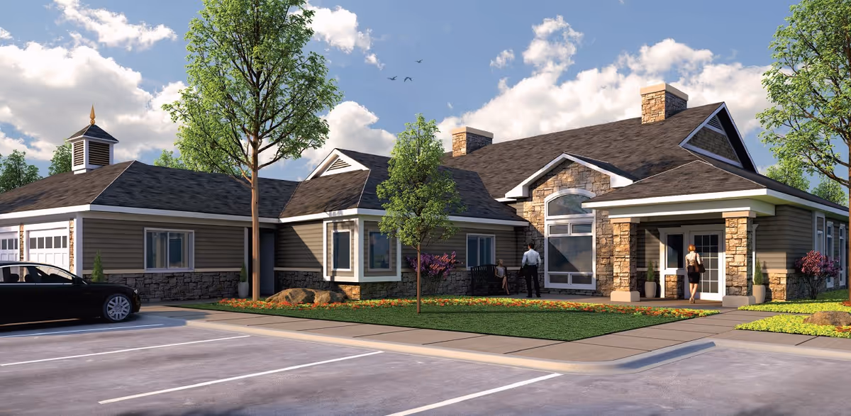 Exterior view of ComfortCare Homes - West with a landscaped front and parking.
