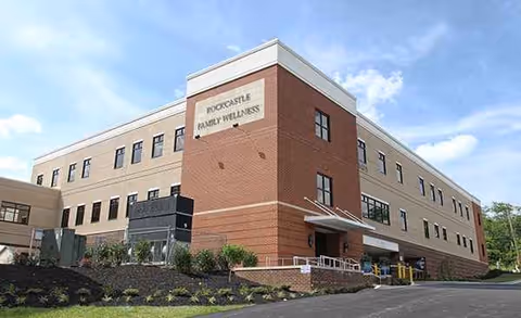 Exterior view of a brick medical building labeled Rockcastle Regional Hospital and Respiratory Care.