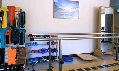 Indoor exercise room at Regency at the Park with ballet barre and equipment.