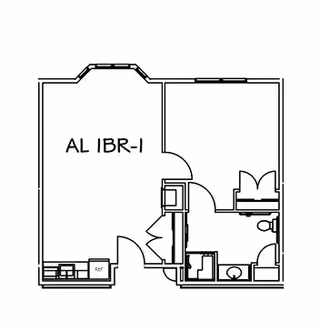 Black and white architectural floor plan labeled AL IBR-1 showing a layout with a main room, a bathroom, and a small kitchen area.