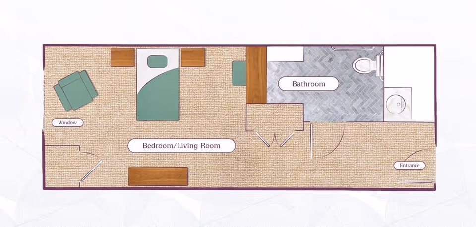 Floor plan of a small living space labeled 'Bedroom/Living Room' with a bed, chair, and furniture, connected to a bathroom with a toilet and sink. The entrance is on the right side.