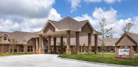 The Rio at Mainland Center entrance with a covered porte-cochere and landscaped grounds.
