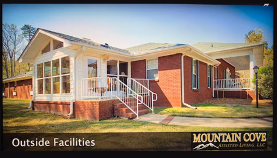 Brick exterior of Mountain Cove facility with white porch and entry stairs.