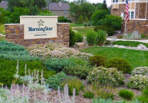 Stone MorningStar Senior Living sign amid landscaped front entrance