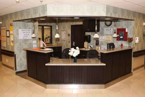 Reception desk in a patterned lobby inside Provo Rehabilitation & Nursing.