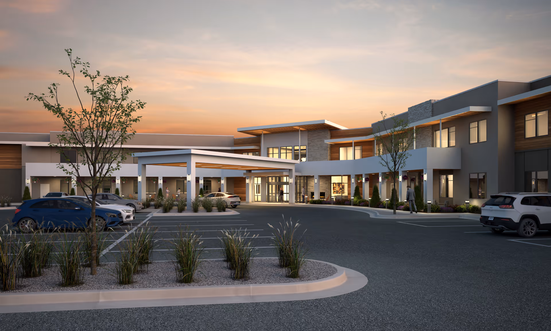 Exterior view of Abbington Senior Living of Murray at sunset, showing a modern two-story building with large windows, a covered entrance, parked cars, and landscaped areas with trees and shrubs.