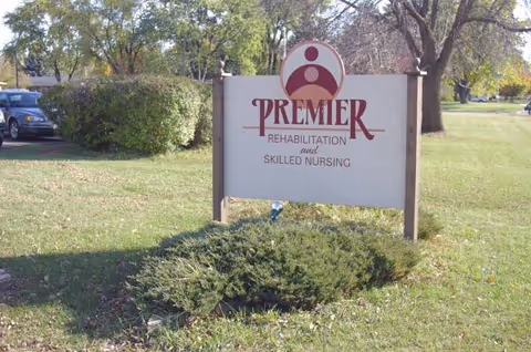 Exterior sign for Premier Rehabilitation and Skilled Nursing at Autumn Lake Beloit with greenery