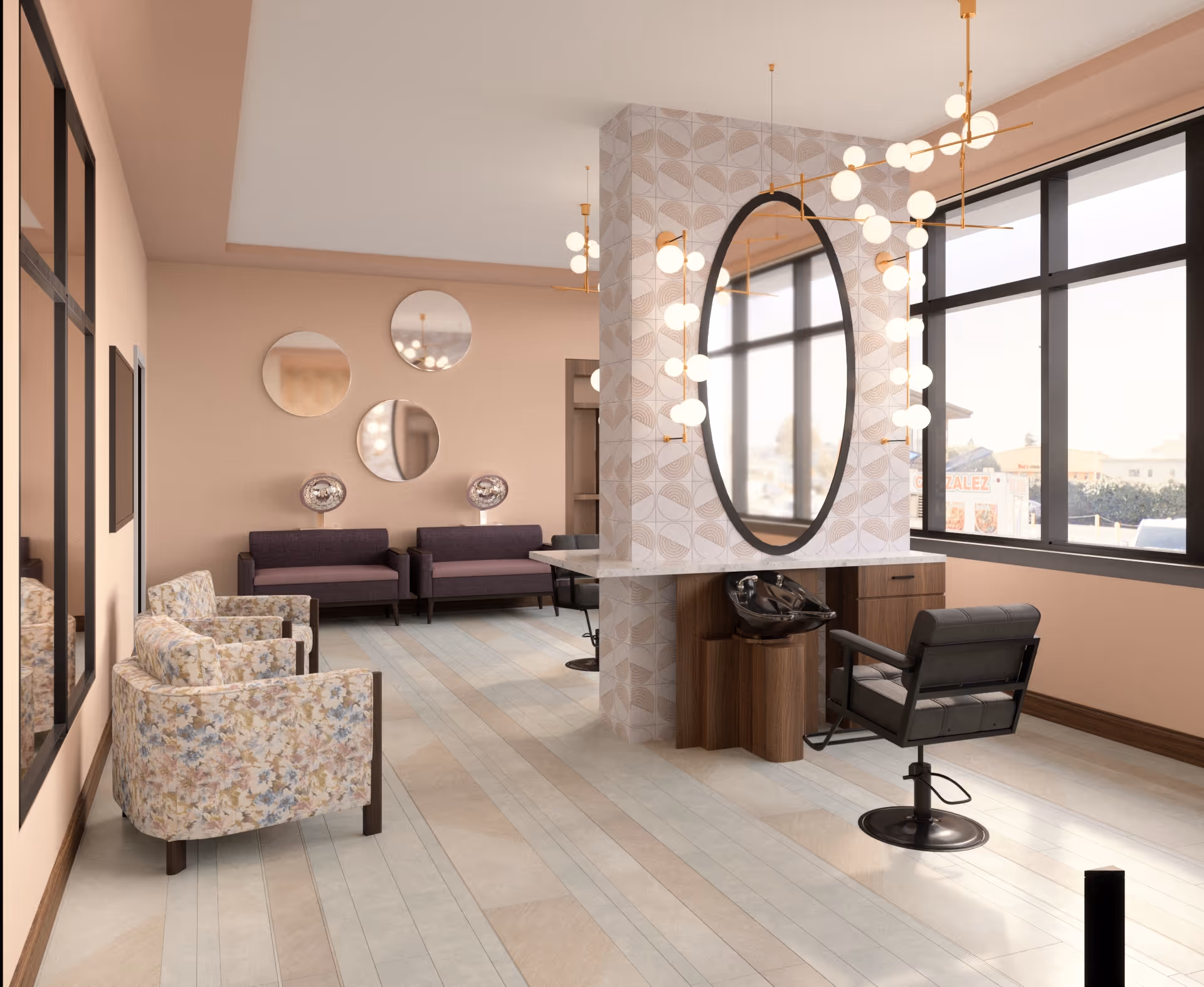 A bright and modern salon area in Bellara Senior Living featuring a large oval mirror mounted on a tiled column with decorative light fixtures. There is a black salon chair and a hair washing station. The room has large windows letting in natural light, floral patterned armchairs, and purple sofas against a beige wall with three round mirrors.