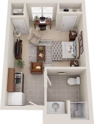 3D floor plan of a senior living studio apartment featuring a combined living and sleeping area with a bed, armchair, desk with computer, and TV. The apartment includes a kitchenette with a sink and stove, a bathroom with a toilet, sink, and shower, and a small entryway.