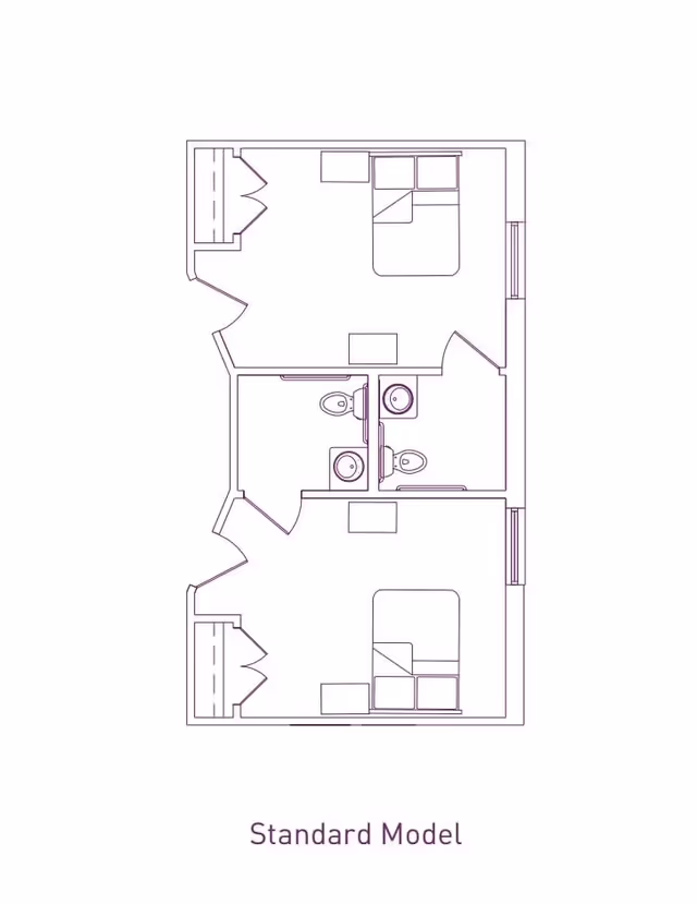 Architectural floor plan labeled Standard Model showing two bedrooms, each with a bed and closet, and two bathrooms with toilets and sinks in between the bedrooms.