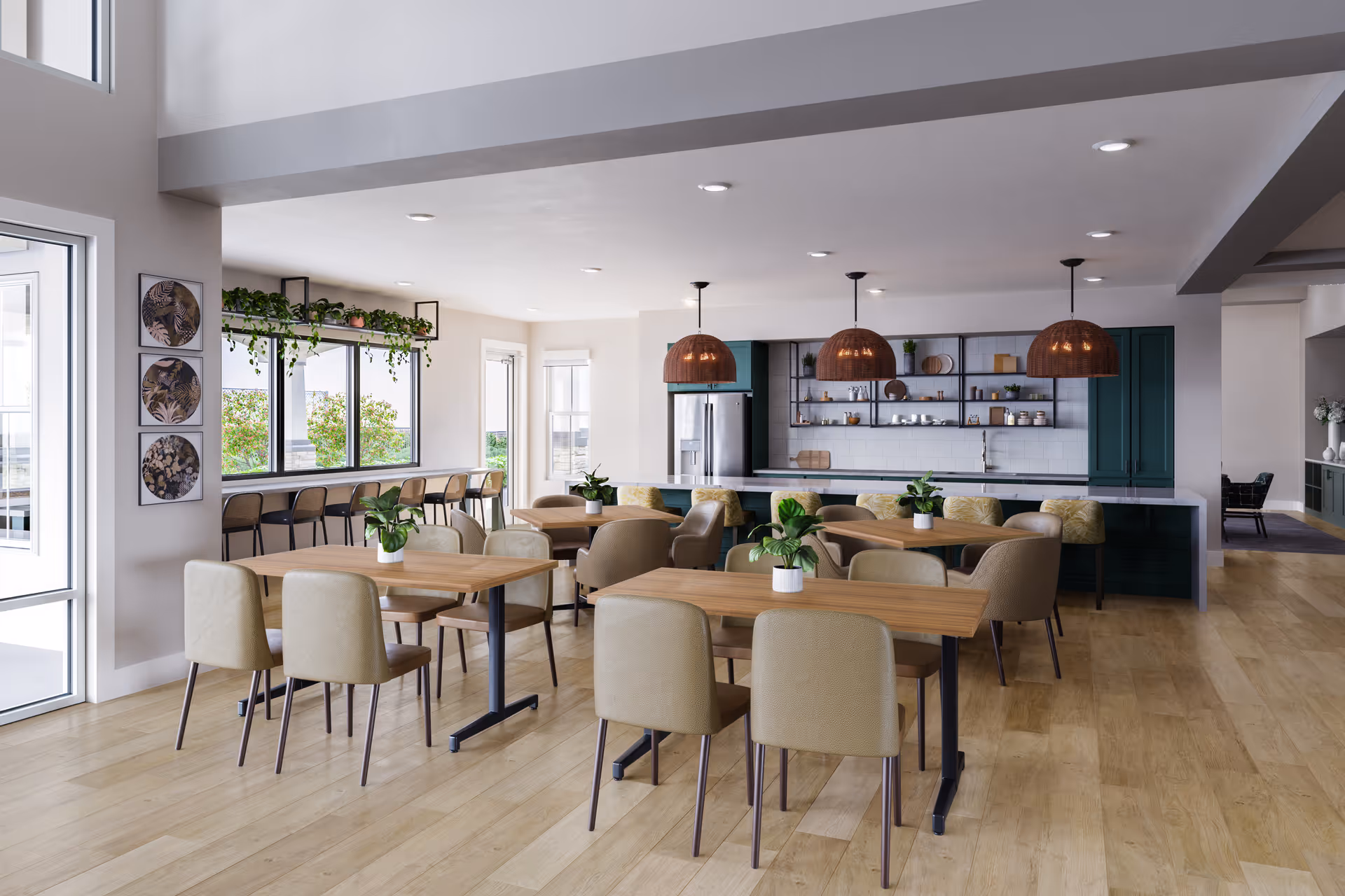 Communal dining area with wooden tables and beige chairs, potted plants, and an open kitchen with green cabinets and pendant lights.
