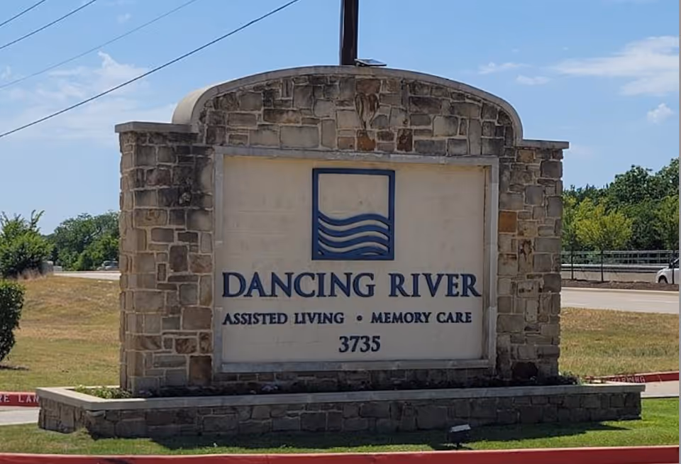 Stone entrance sign for Dancing River Assisted Living and Memory Care.