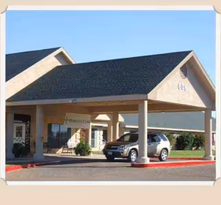 Exterior view of Meridian Care of Hebbronville entrance with a covered drop-off area.