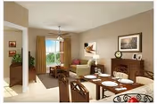 Bright dining and living area with a table set for a meal and cozy seating.
