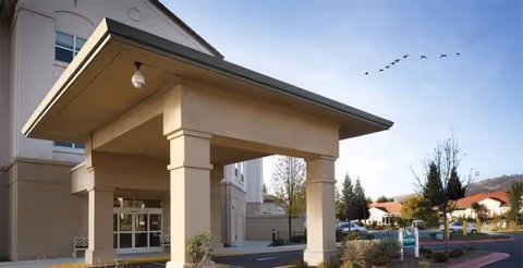 Exterior view of Quail Creek at Paradise Valley showing the entrance porte-cochere.