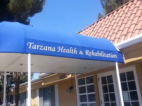 Blue canopy reads Tarzana Health and Rehabilitation over a beige building entrance.