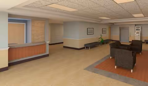 Lobby-like common area with a reception desk, seating, and plants.