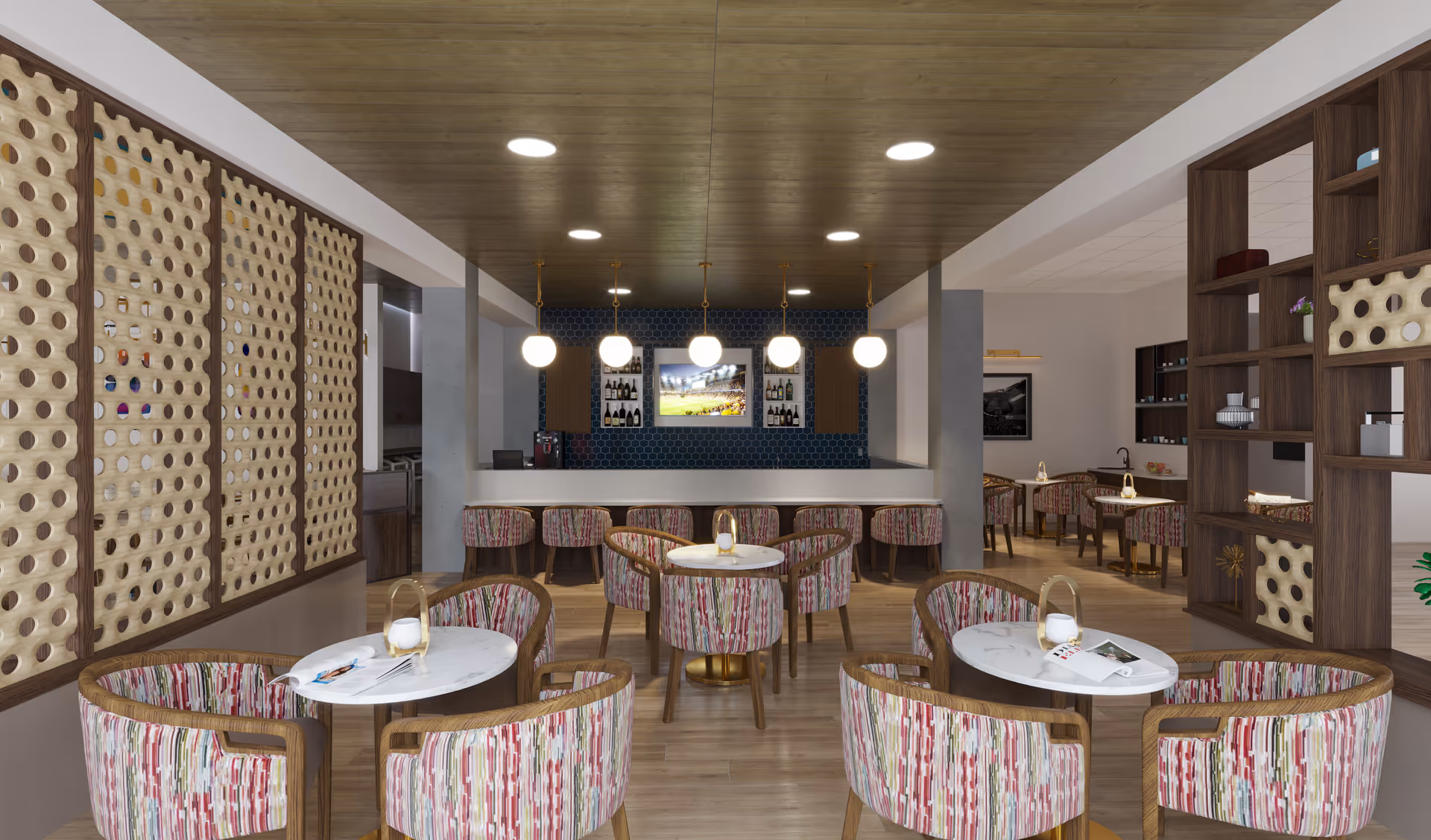 Bright modern dining/lounge area with round marble-top tables, patterned chairs, and a central bar with pendant lights.