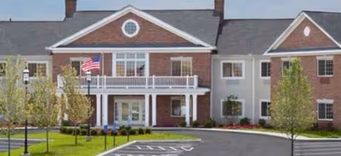 Front view of The Landing of Long Cove facility with brick exterior and entry porch.