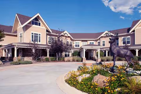 Exterior view of MorningStar Assisted Living and Memory Care of Littleton with a horse statue.