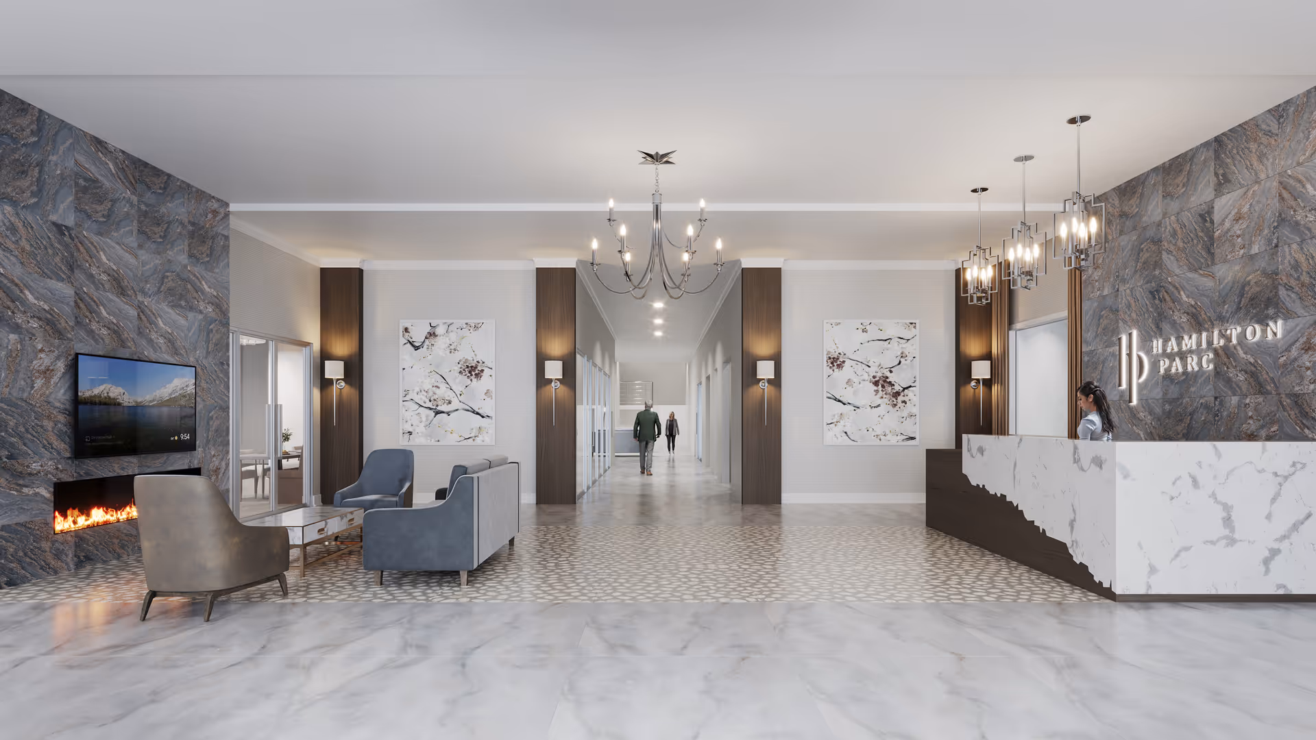 Modern senior living facility lobby with a marble reception desk on the right, a woman standing behind it, a seating area with chairs and a sofa near a fireplace and a wall-mounted TV on the left, and a hallway with two people walking in the background. The walls have decorative panels and artwork, and there are chandeliers and pendant lights hanging from the ceiling.