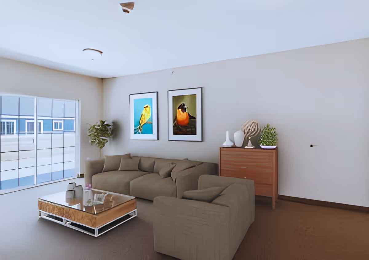 Neutral-toned living room with a sectional sofa, glass-top coffee table, framed bird artwork, a side dresser with plants, and a large window.