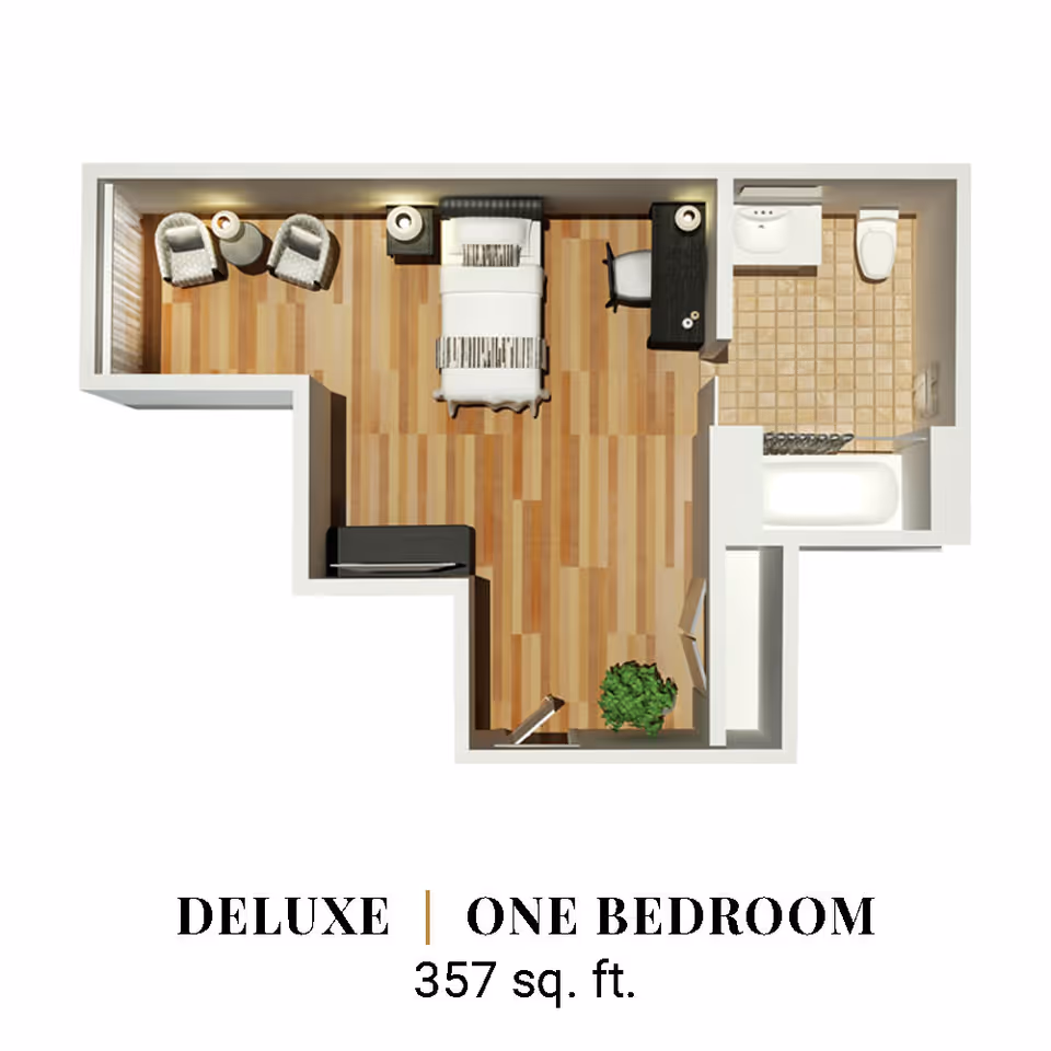 Floor plan of a deluxe one-bedroom apartment with 357 square feet, showing a bedroom area with a bed, two chairs and a small table, a desk with a chair, a bathroom with a sink, toilet, and bathtub, and a small entry area with a plant.