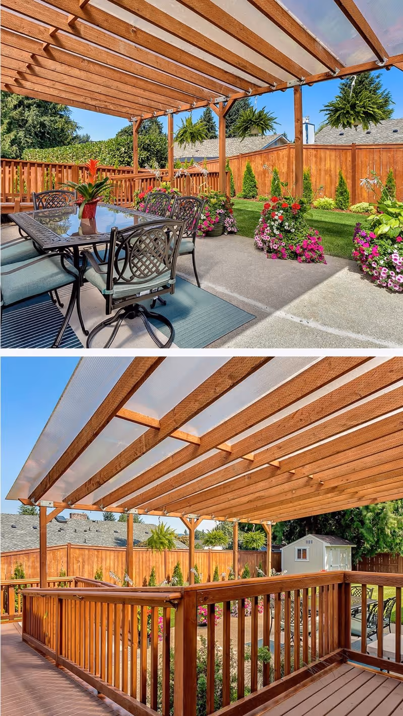Two images showing an outdoor patio area with a wooden pergola roof. The first image features a glass-top dining table with six metal chairs on a concrete floor, surrounded by colorful flower pots and hanging plants, with a wooden fence and green lawn in the background. The second image shows a wooden deck with railing under the same pergola, overlooking a garden area with flowers and a small white shed, all enclosed by a wooden fence.