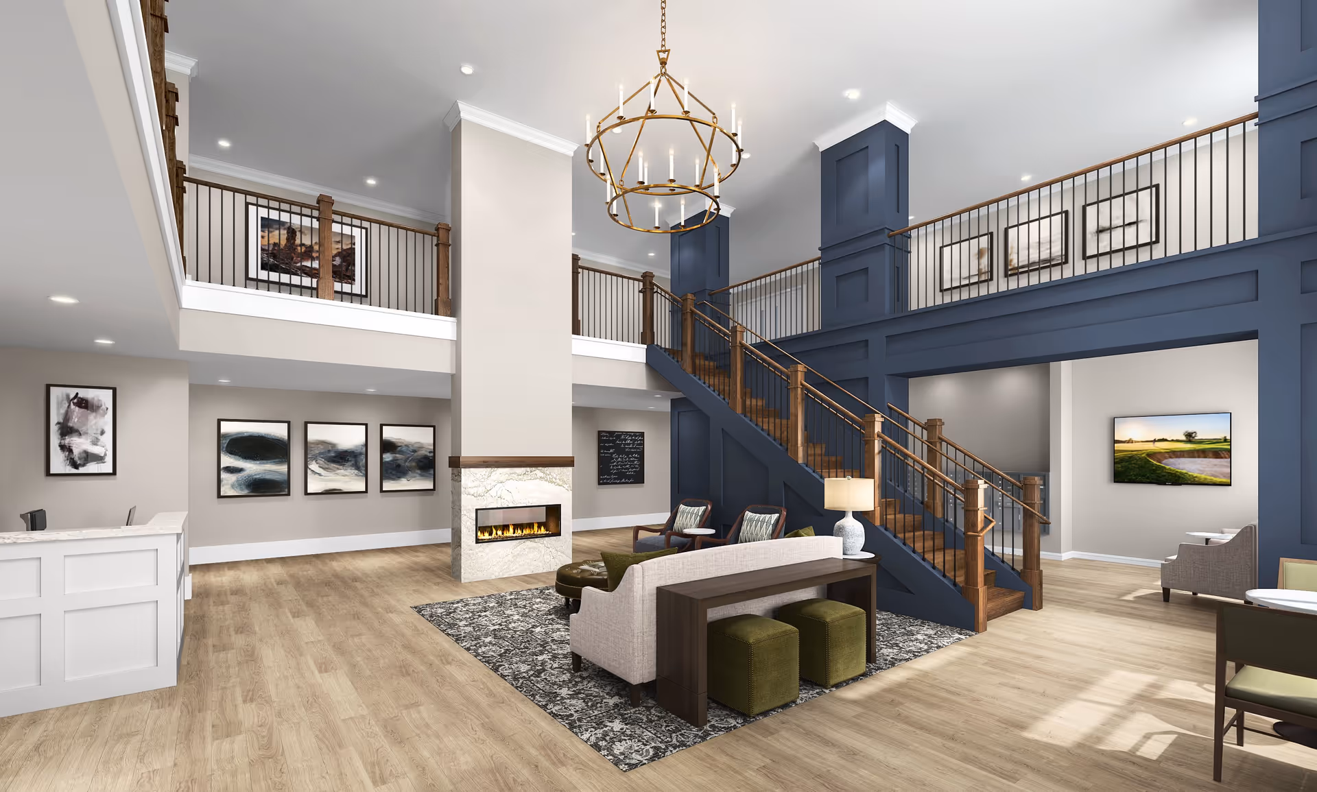 A spacious and modern senior living facility common area with light wood flooring, a central fireplace with a marble surround, and a staircase with wooden handrails and blue paneling leading to an upper balcony. The room features comfortable seating including a beige sofa, green ottomans, and armchairs arranged on a patterned rug. The walls are decorated with abstract art and a large chandelier hangs from the ceiling.